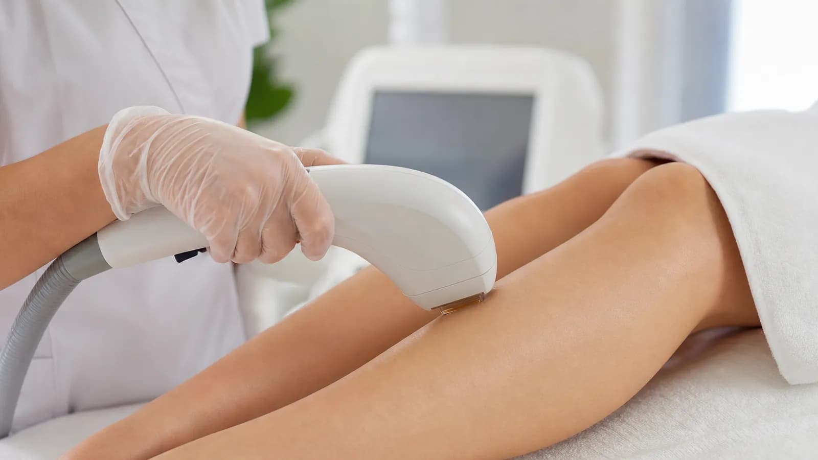 Laser hair removal session on a patient’s leg